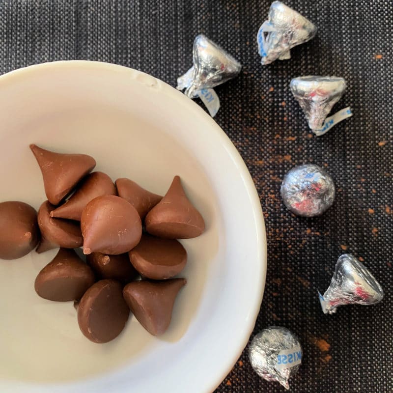 Preparing Halloween Chocolate Sugar cookies with chocolate kisses