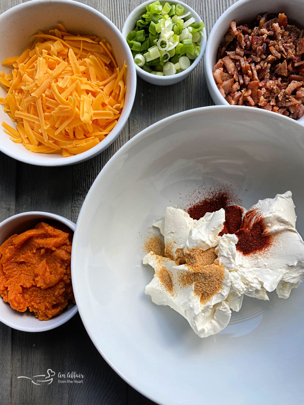 Savory Pumpkin Dip with Bacon full of cheese and a little bit of a