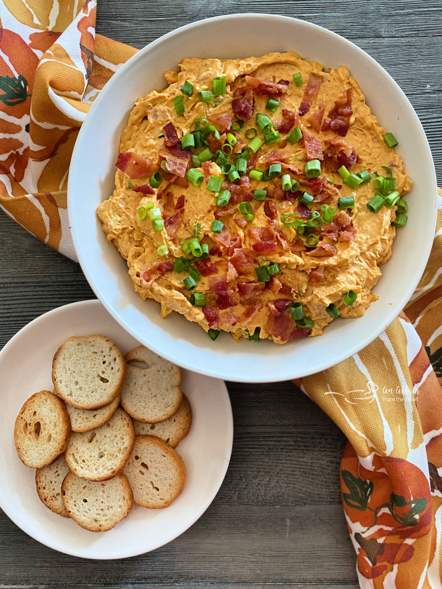 Savory Pumpkin Dip with Bacon full of cheese and a little bit of a ...