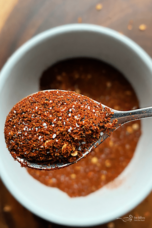 Homemade Chili Seasoning in white bowl spoonful