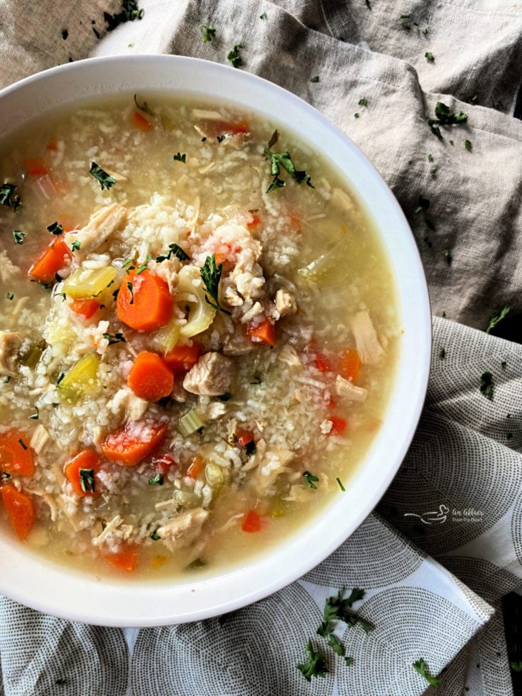 Close up of Instant Pot Chicken & Rice Soup in a white bowl