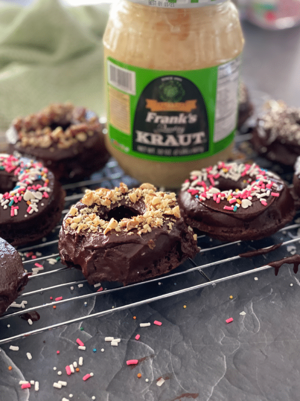 Chocolate Kraut donuts on a cooling rack