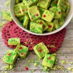 Grinch Shortbread Bites on a red heart shaped doily