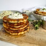Mashed Potato Cakes stacked on cutting board