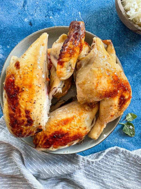 Top view of roasted chicken in bowl 