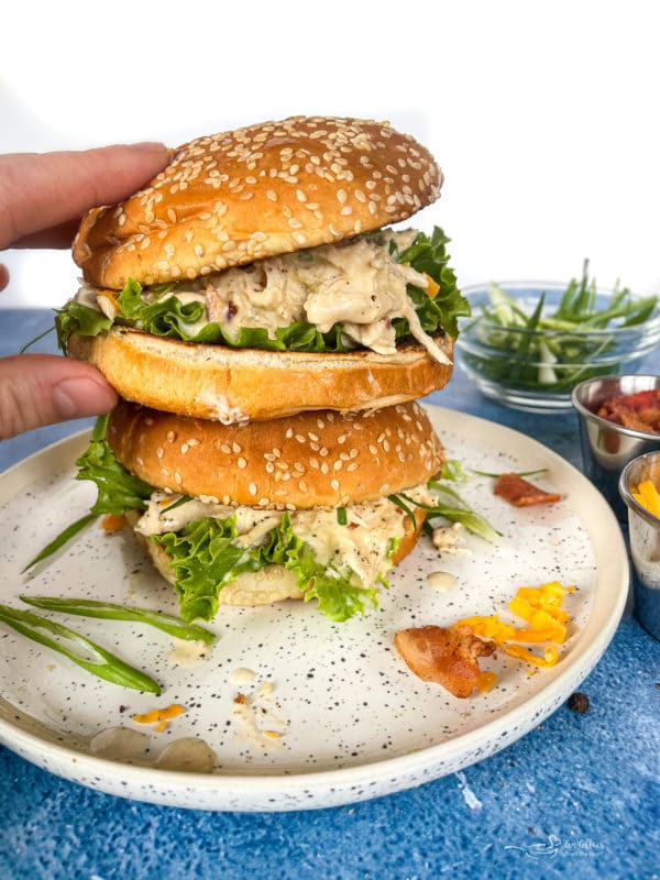 Two stacked sandwiches with Instant Pot crack chicken in the center with lettuce