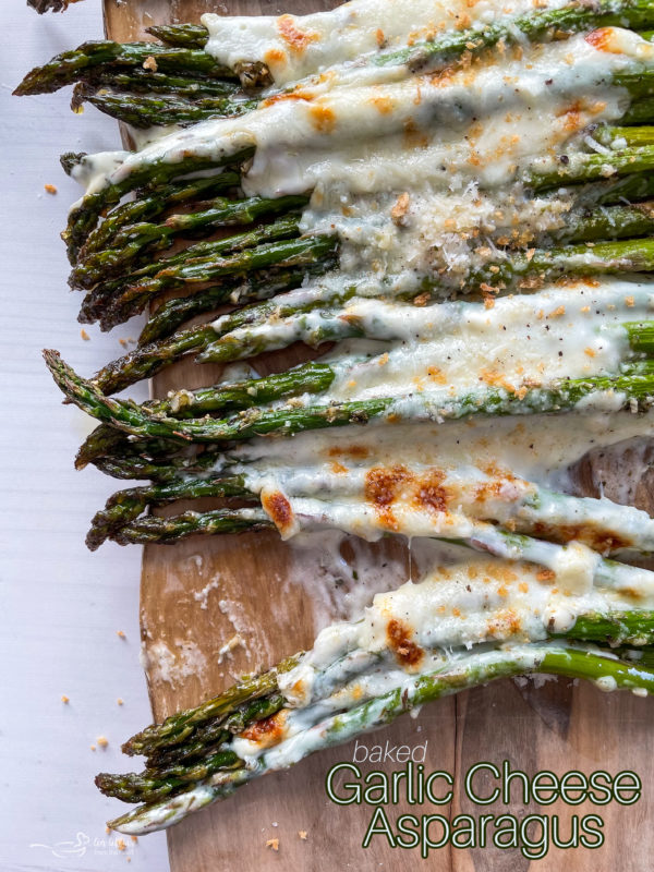 Top view of asparagus topped with melted cheeses