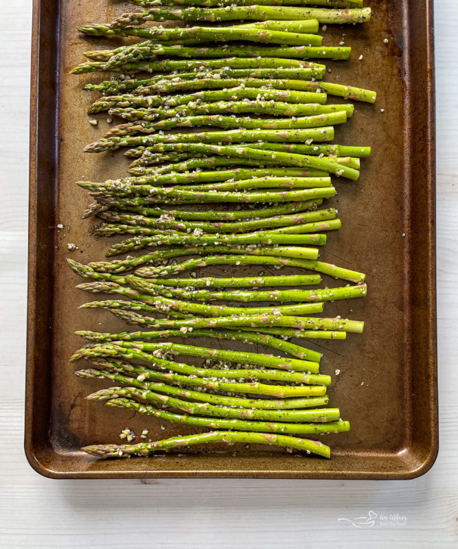 Top view of asparagus on baking sheet