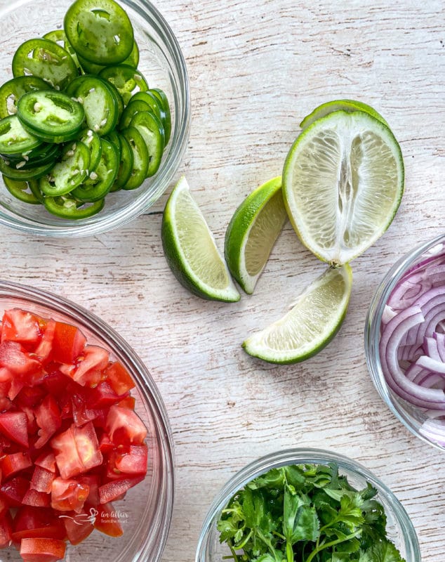 Tomatoes, cilantro, jalapeños, lime, and onions