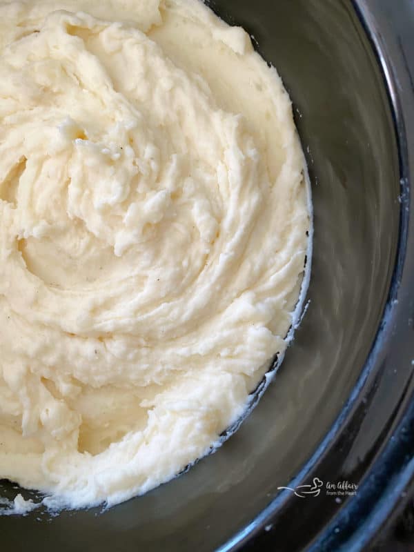 Close view of mashed potatoes in slow cooker