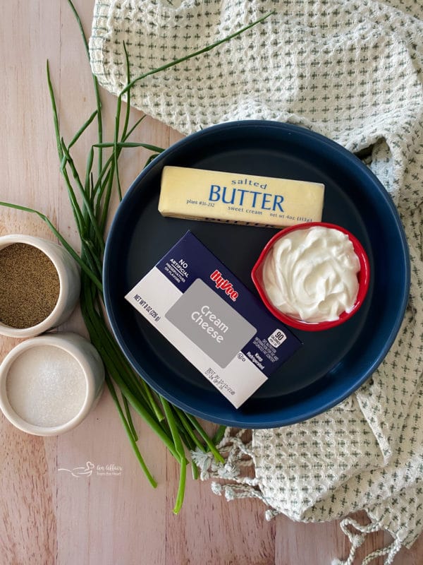 Butter, salt, pepper, and cream cheese for the best mashed potatoes in the slow cooker