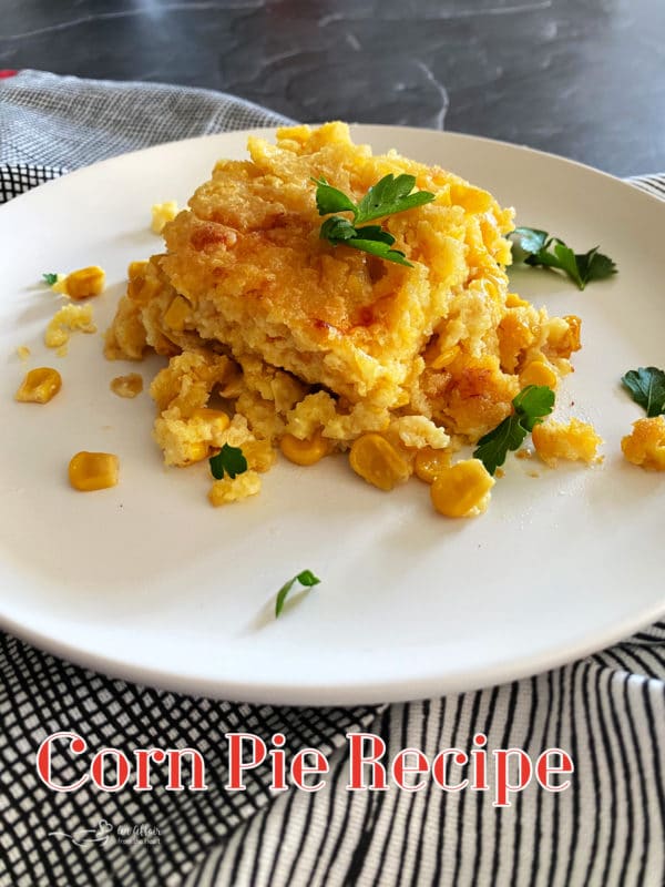 Corn pie on white plate with parsley