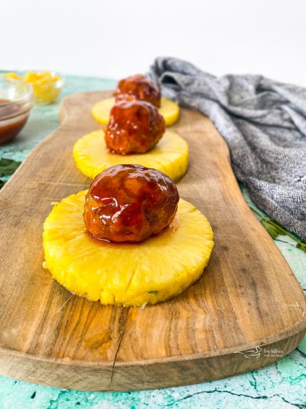 Hawaiian ham balls on top of pineapple slices
