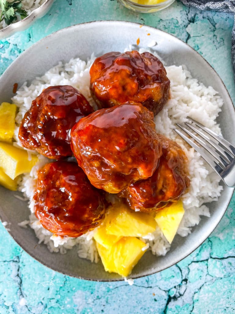 Close view of Hawaiian ham balls with pineapple sauce