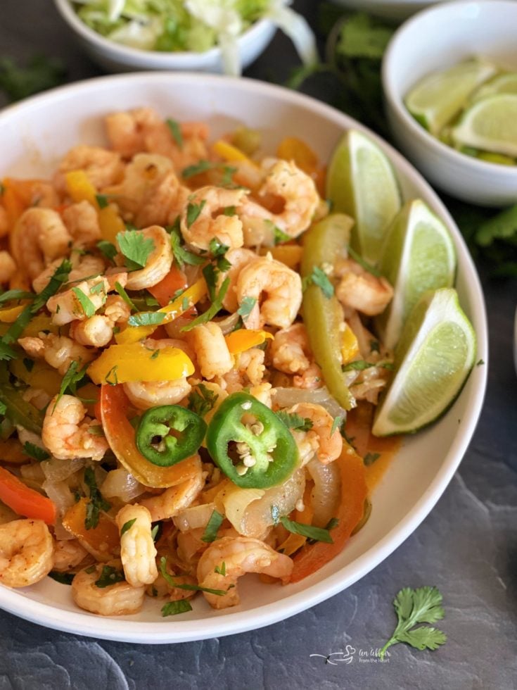 https://anaffairfromtheheart.com/wp-content/uploads/2021/05/sheet-pan-shrimp-fajitas-with-cilantro-lime-butter-735x980.jpg