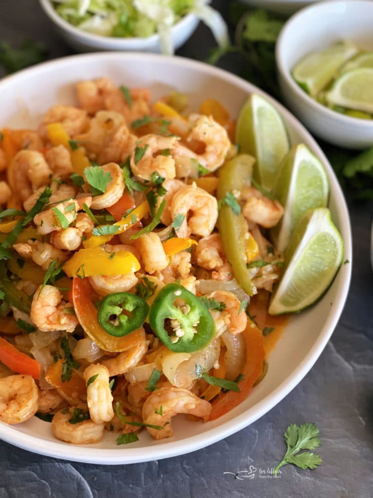 Cilantro Lime Shrimp Sheet Pan Fajitas in a white serving bowl