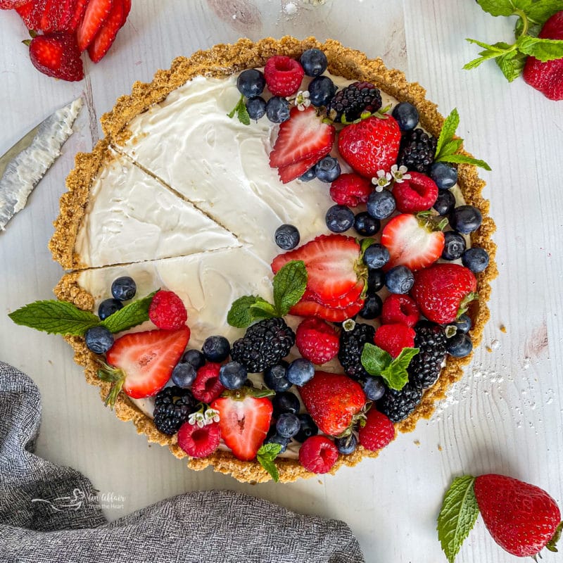 one whole tart with fresh fruit and mint
