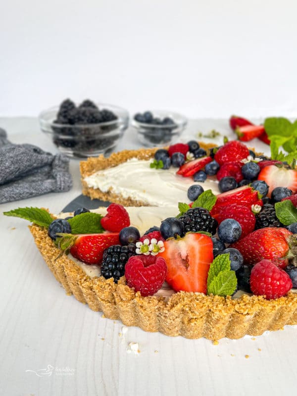 Front view of no bake fruit tart with berries