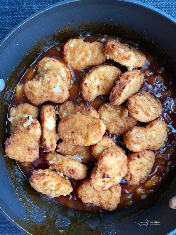 chicken nuggets cooking in sauce