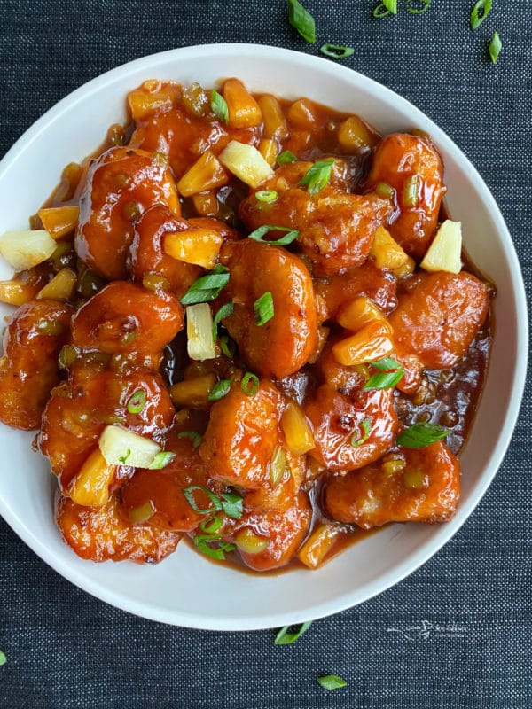 one plate filled with sweet & sour chicken 