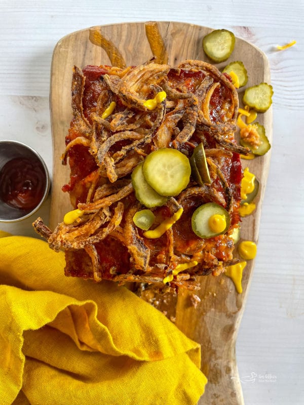 bacon cheeseburger meatloaf with fried onions and fresh pickles