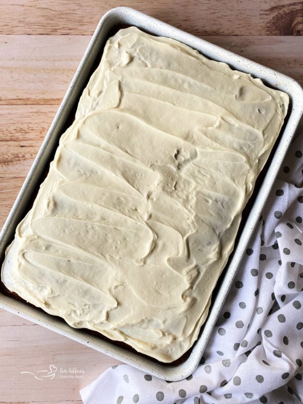 top view of carrot cake bars topped with cream cheese frosting