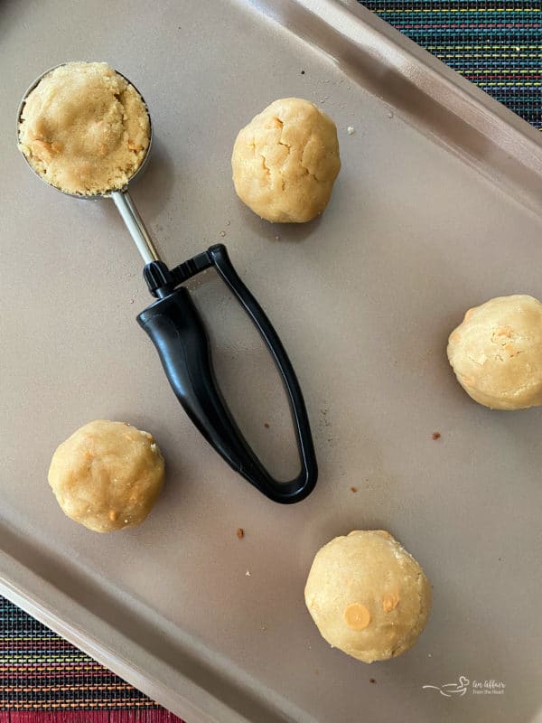 top view of rounded cookie dough on baking sheet