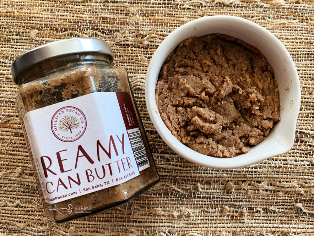 top view of pecan butter jar with a bowl 