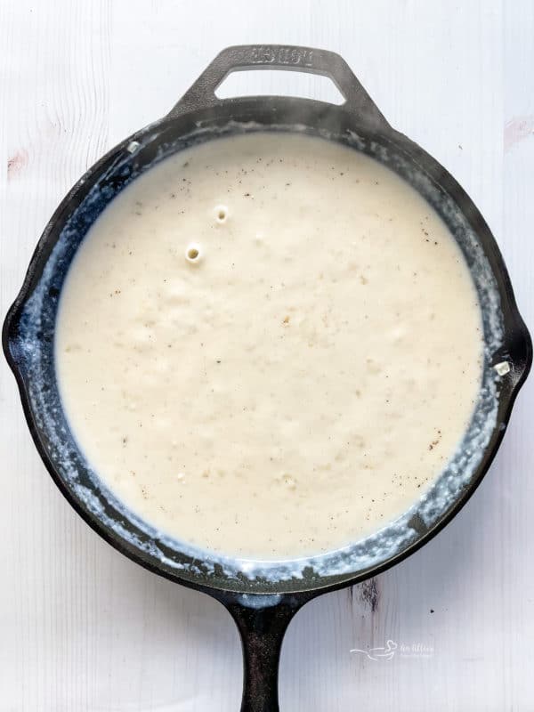 sauce in cast iron skillet for potatoes