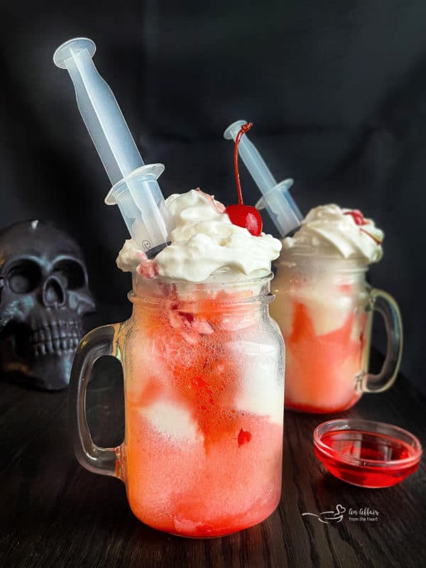 two bloody dirty shirley float with a syringe side view