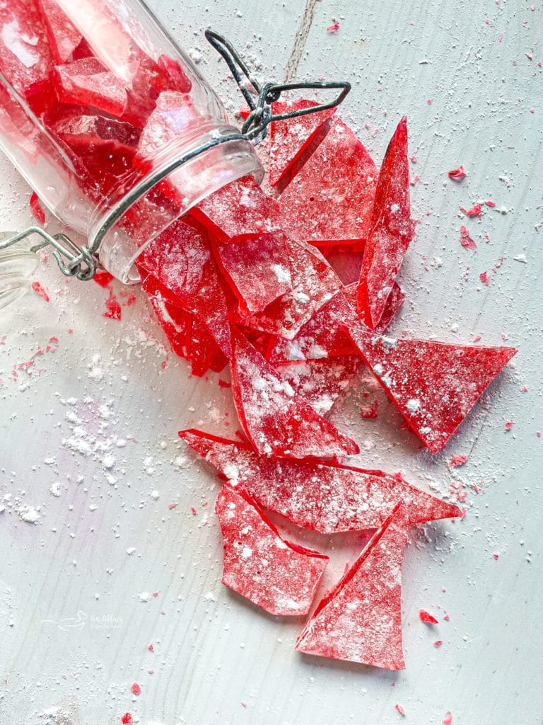 cinnamon rock candy broken into tiny pieces in a jar