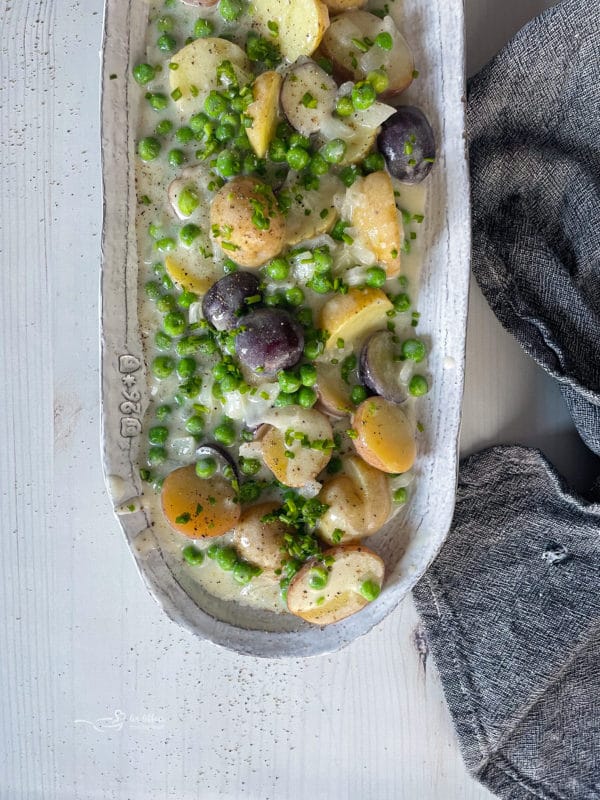 dish filled with new potatoes and peas