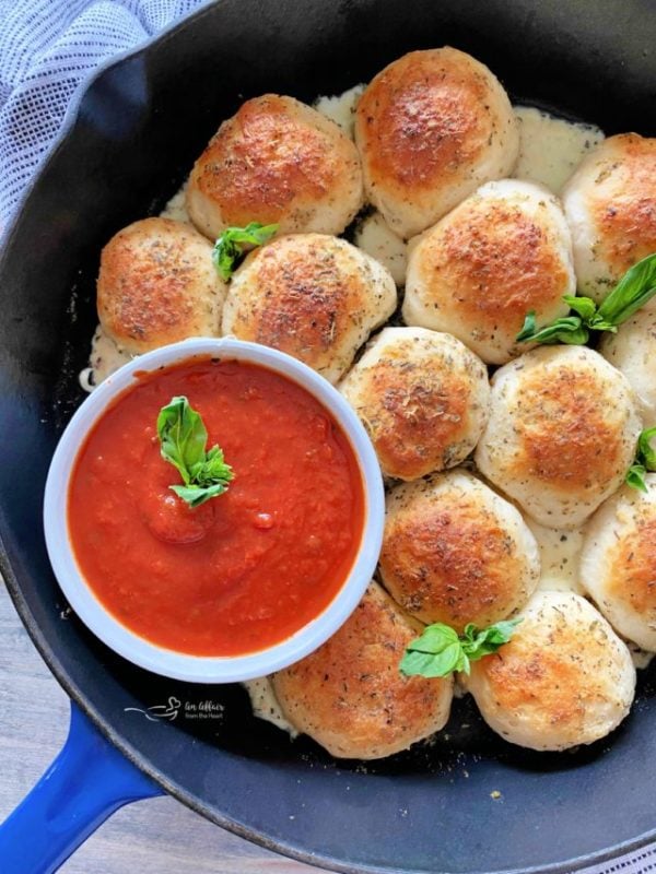Overhead of Italian Cheese Bombs in a blue skillet