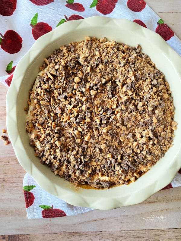 top view of apple dip with toffee bits on top in pie plate