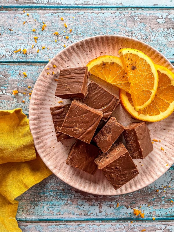 one plate with squares of orange fudge