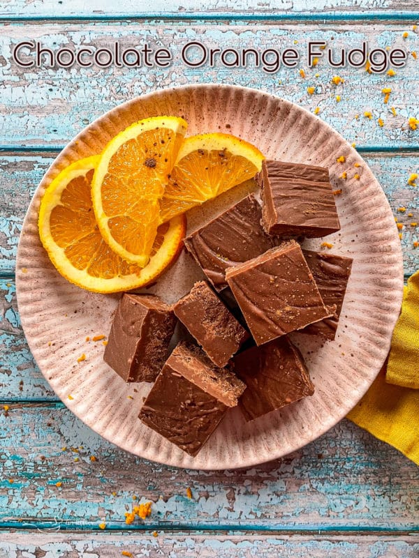 top view of cubes of chocolate orange with orange slices 