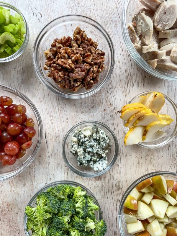 toppings for salad such as broccoli, blue cheese, grapes, pears, walnuts, celery, apples. chicken