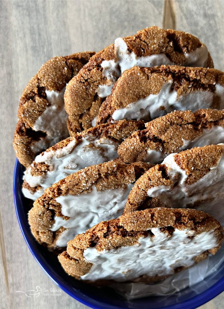 iced molasses ginger cookies in blue container