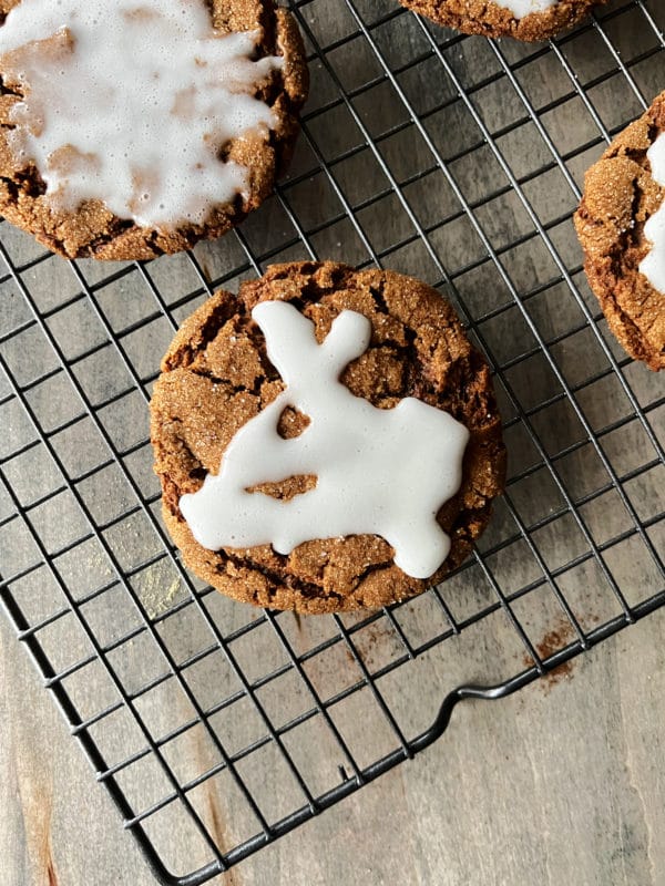 iced molasses cookies on wire rack 