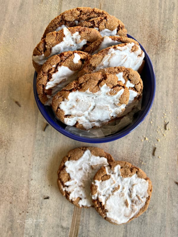 molasses cookies with icing in blue bowl 