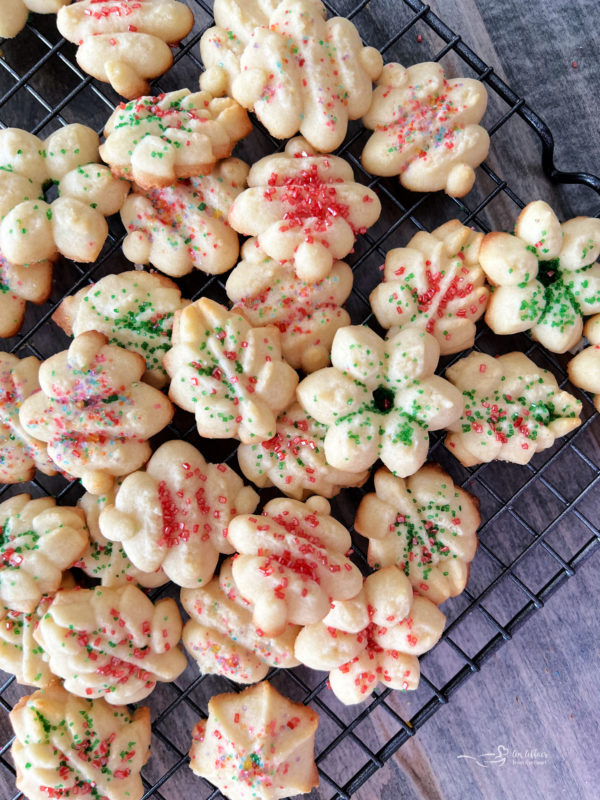 close view of spritz cookie on wire rack