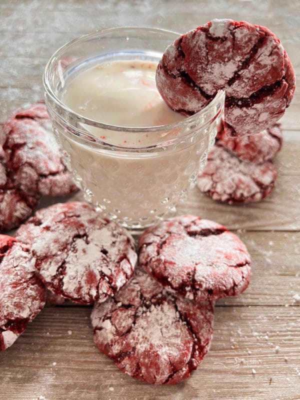 red crinkle cookie in glass of milk