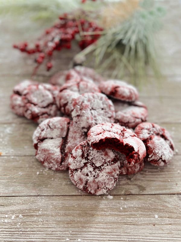 red velvet crinkle cookies on wooden surface