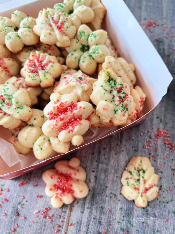 one box filled with colorful spritz cookies