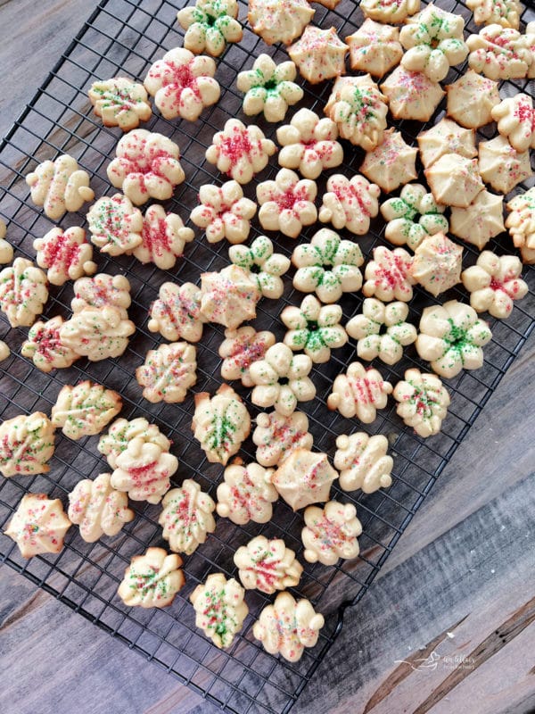 baked spritz cookies on wire rack