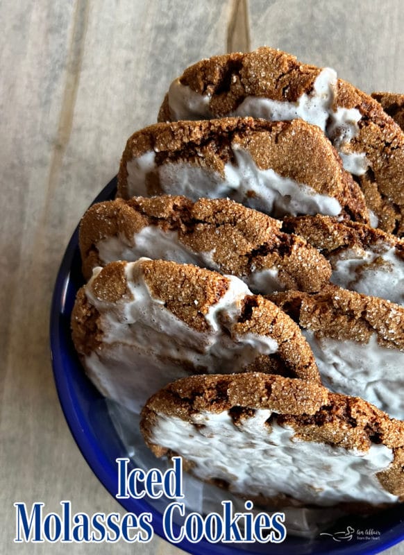 to view of iced molasses cookies on blue plate 