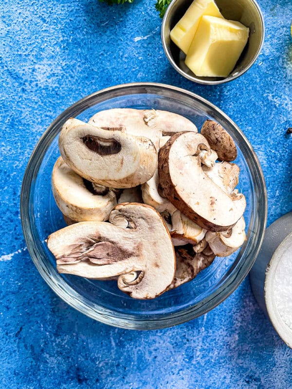 bowl of sliced mushrooms with butter