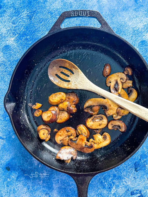 cooking mushrooms in skillet 