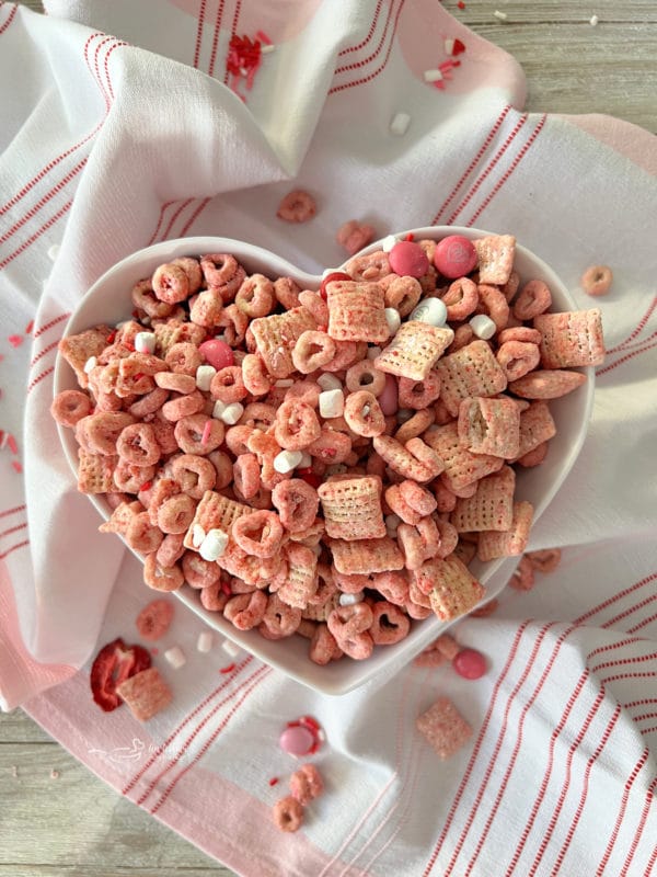 top view of strawberry chex mix in heart dish 