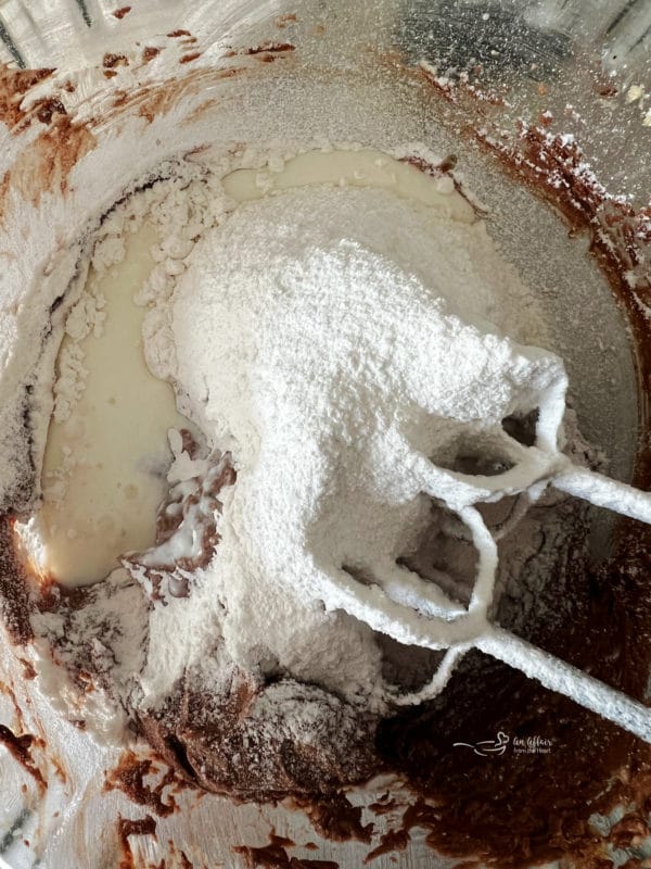 mixing flour into melted chocolate 